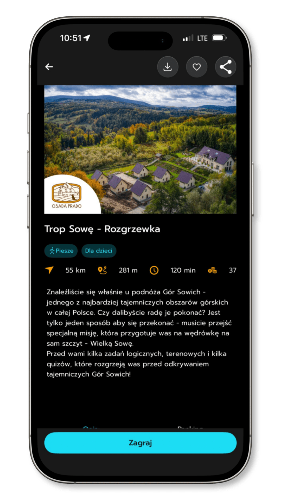 Zrzut ekranu z aplikacji mobilnej prezentujący grę edukacyjną „Trop Sowę – Rozgrzewka” z grafiką przedstawiającą ujęcie z lotu ptaka Osady Prado
